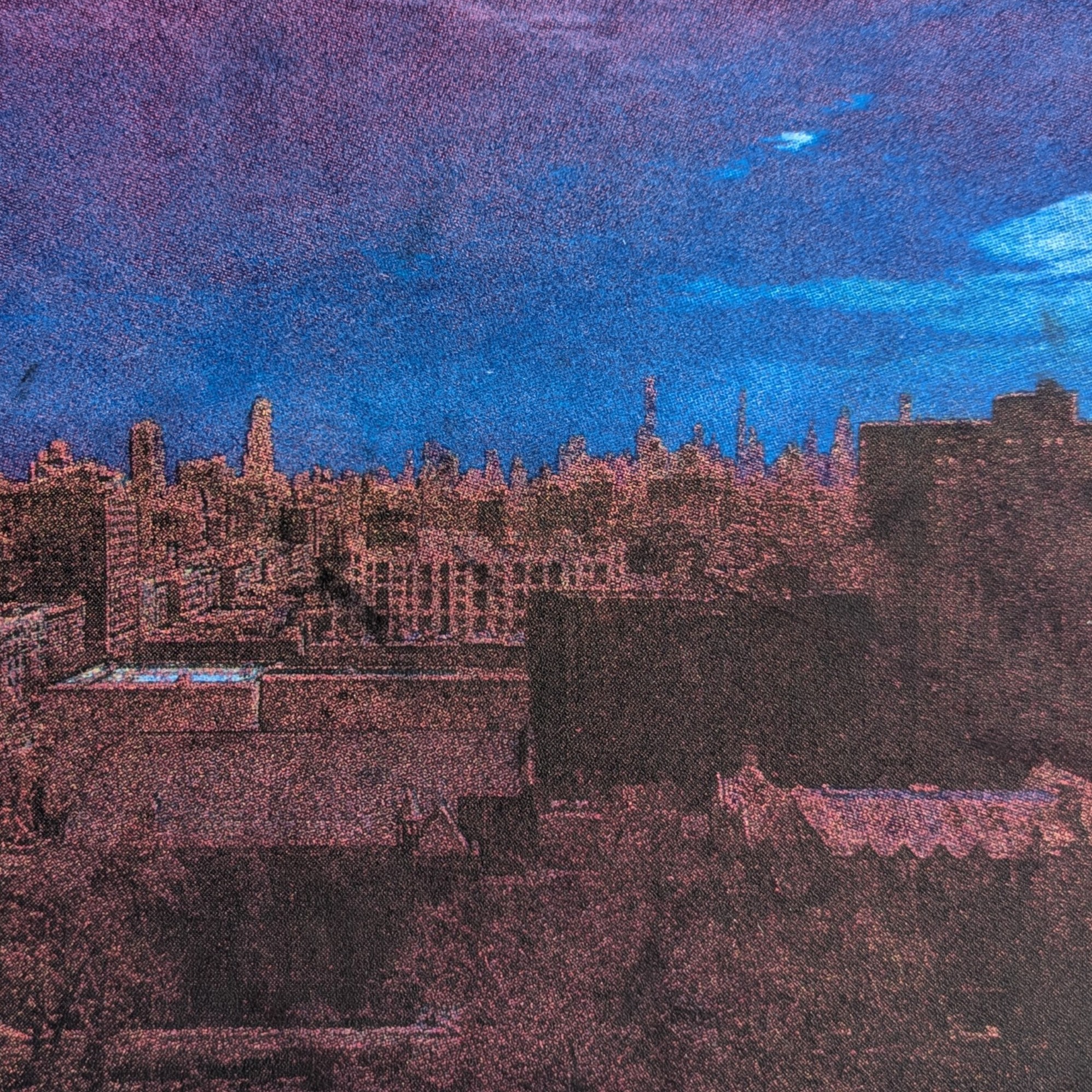 A drypoint of a photo taken from the top of St John's Cathedral, showing an aerial view of Manhattan